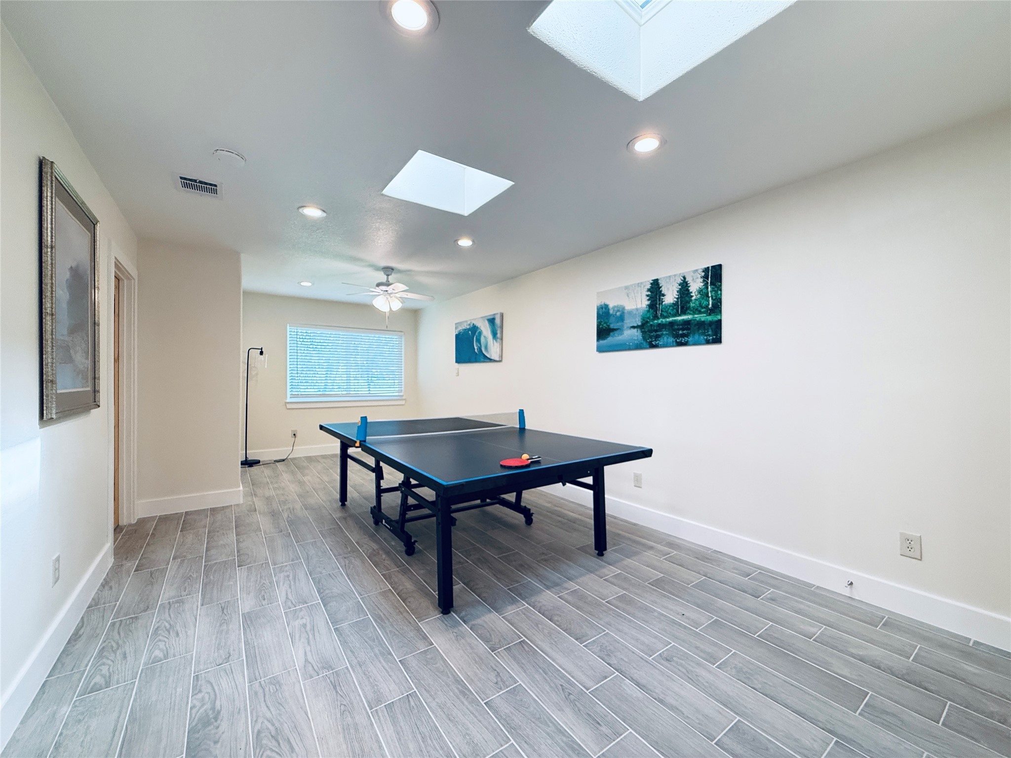 3936 Wagon Road Dickinson, TX 77539 - Photo 14 of 45 a living room with furniture and a wooden floor