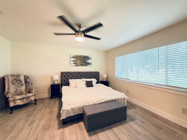 a bedroom with a bed and a couch