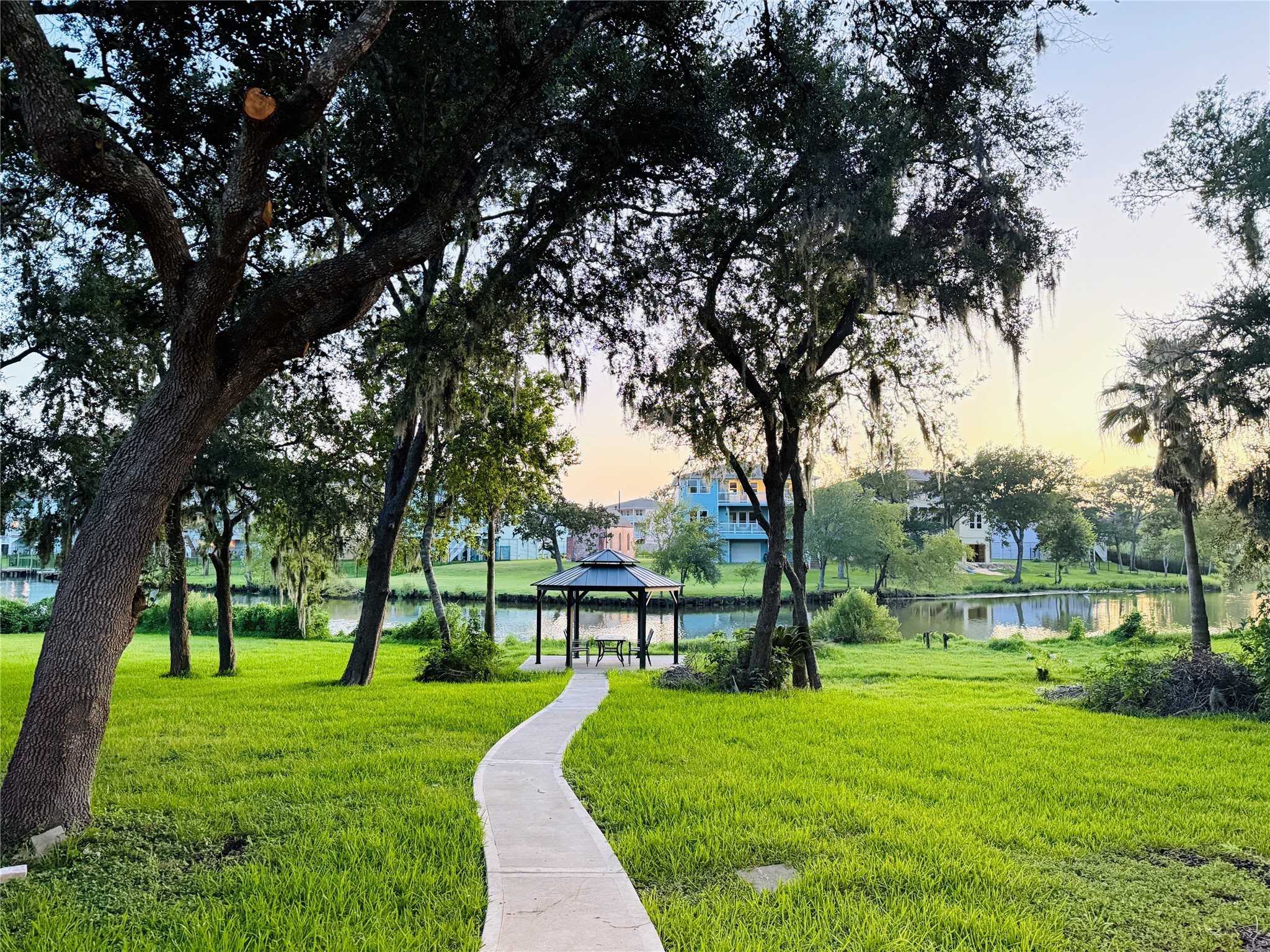 3936 Wagon Road Dickinson, TX 77539 - Photo 2 of 45 a view of a park with large trees