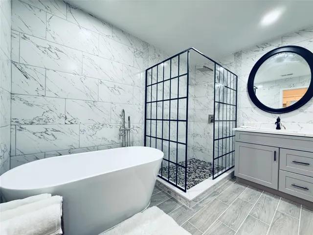 a bathroom with a bathtub and a sink