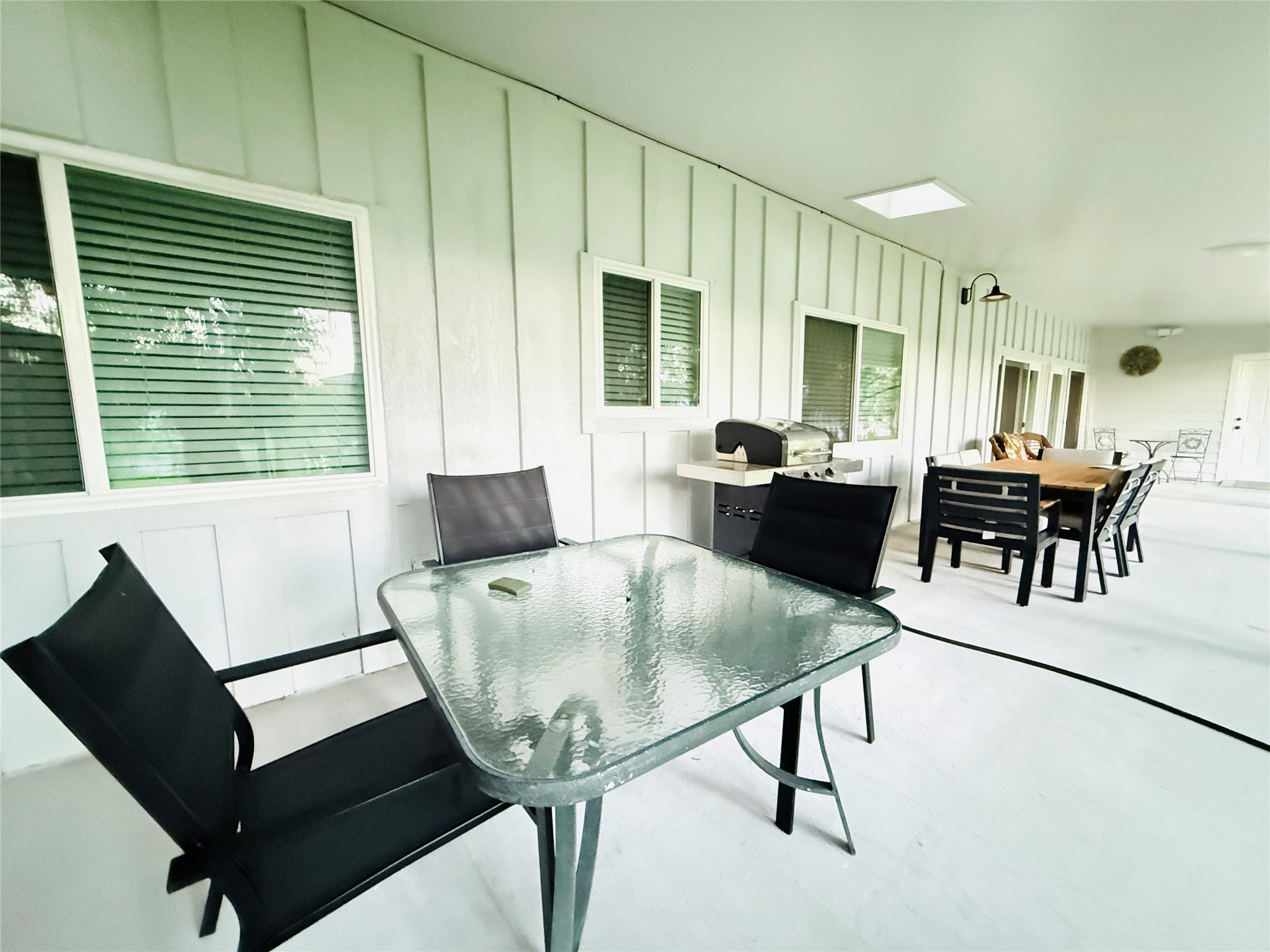 3936 Wagon Road Dickinson, TX 77539 - Photo 37 of 45 a view of a dining room with furniture window and wooden floor