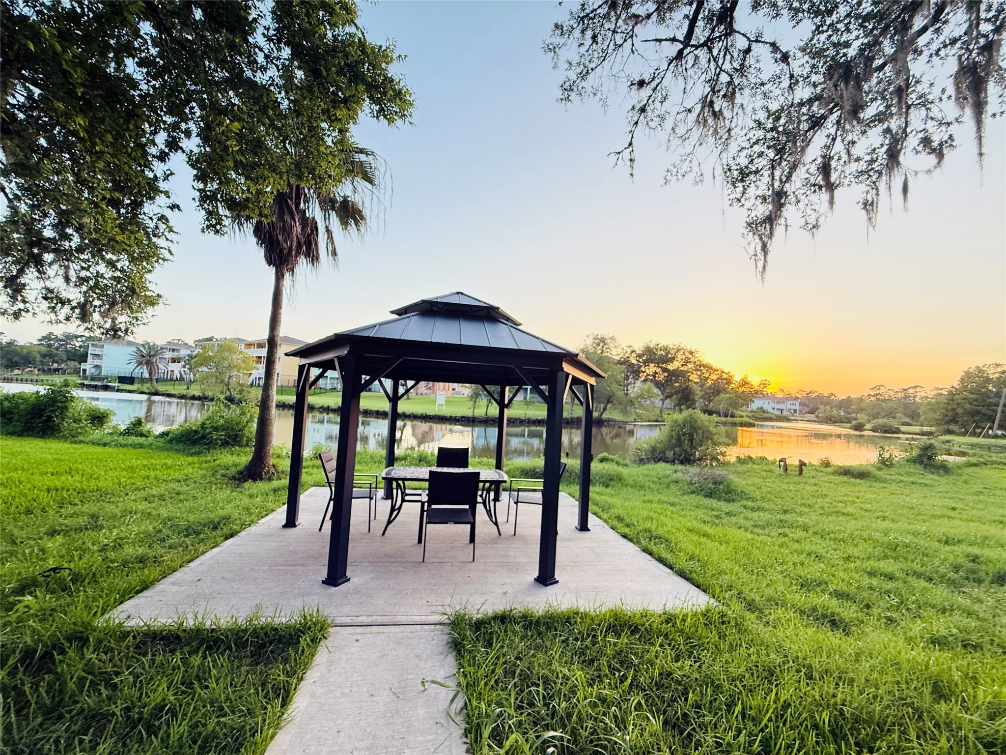 3936 Wagon Road Dickinson, TX 77539 - Photo 40 of 45 a view of a garden with a bench in a garden
