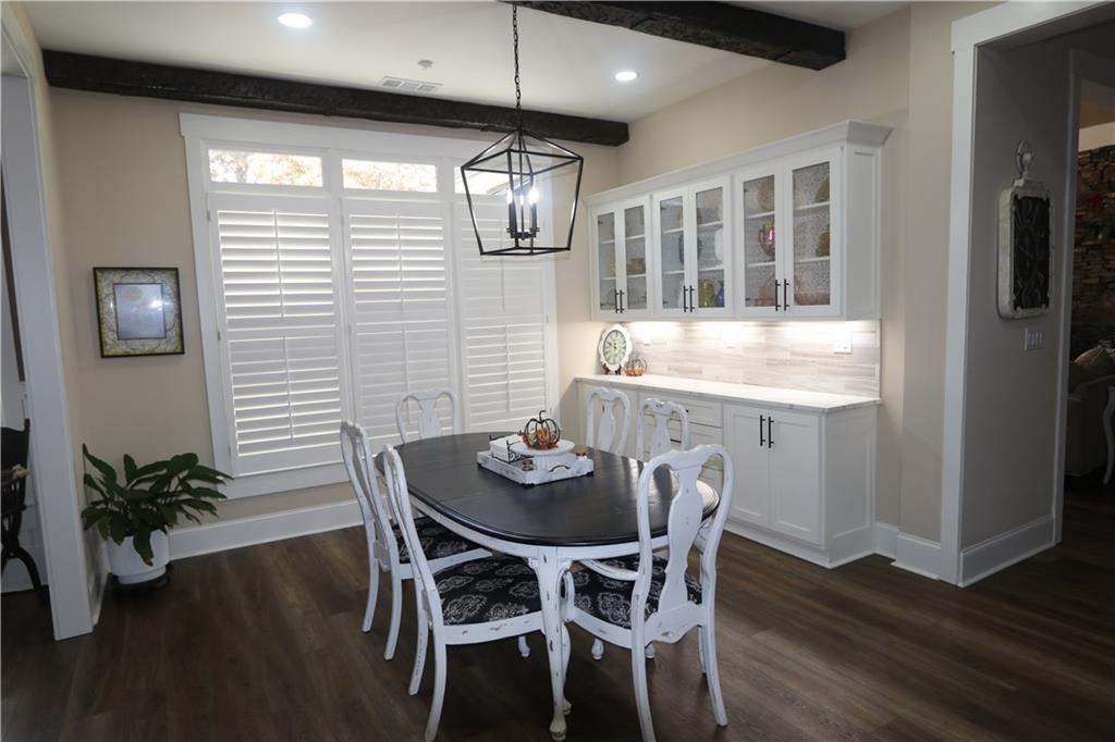3251 Lenora Church Road Snellville, GA 30039 - Photo 12 of 48 a view of a dining room with furniture window and wooden floor