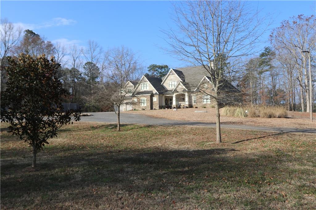 3251 Lenora Church Road Snellville, GA 30039 - Photo 2 of 48 a view of a yard with trees