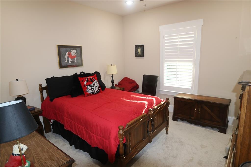 3251 Lenora Church Road Snellville, GA 30039 - Photo 23 of 48 a bedroom with a bed and window