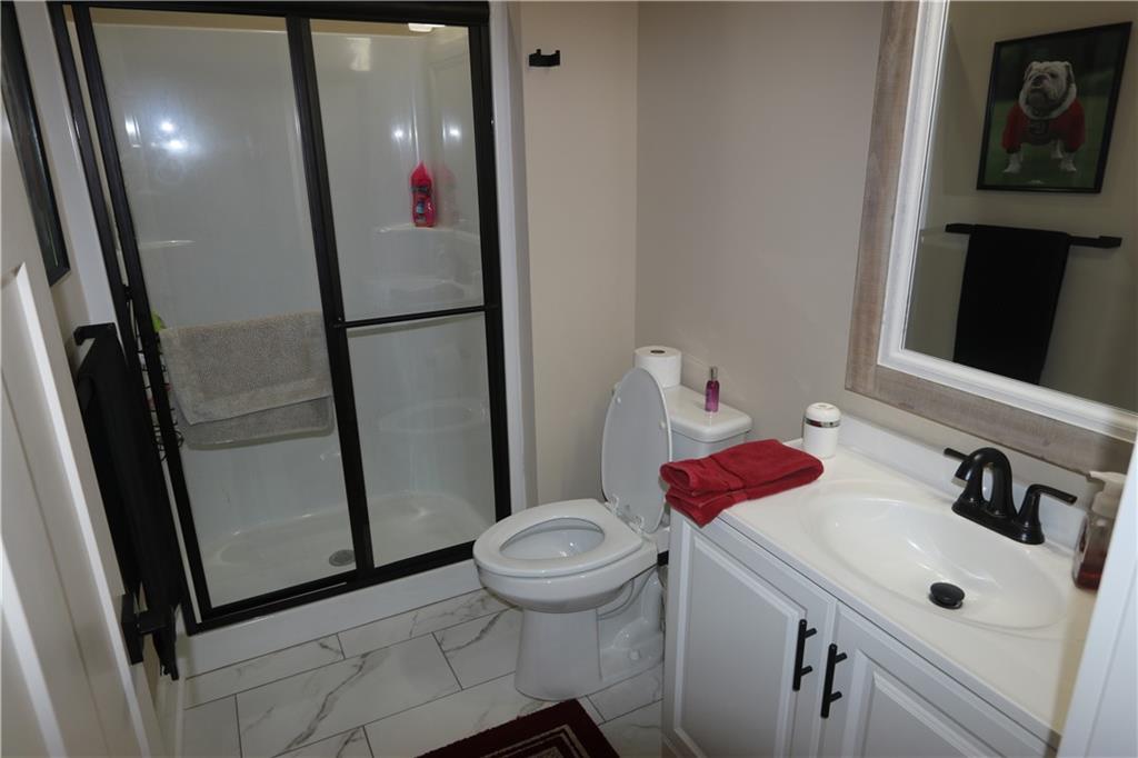 3251 Lenora Church Road Snellville, GA 30039 - Photo 24 of 48 a bathroom with a sink and a mirror