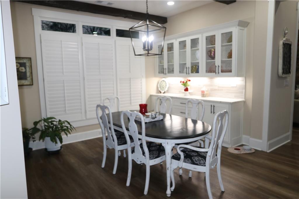 3251 Lenora Church Road Snellville, GA 30039 - Photo 30 of 48 a view of a dining room with furniture and wooden floor