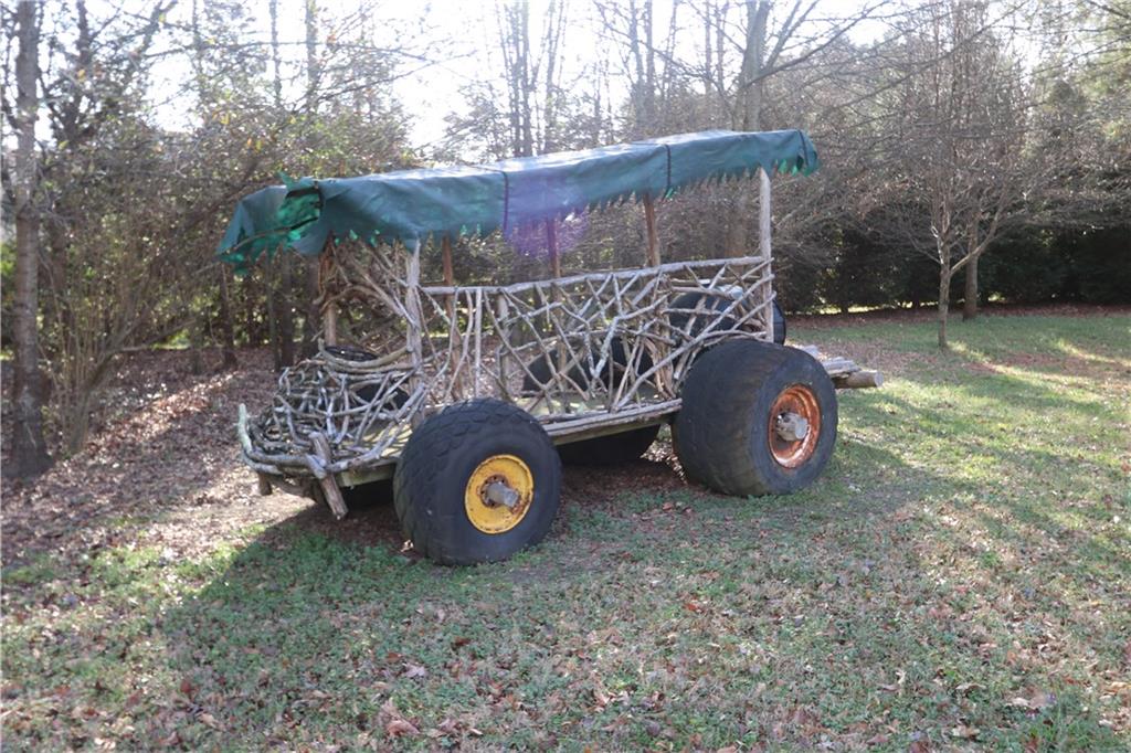 3251 Lenora Church Road Snellville, GA 30039 - Photo 42 of 48 a view of a house with a yard and parking space