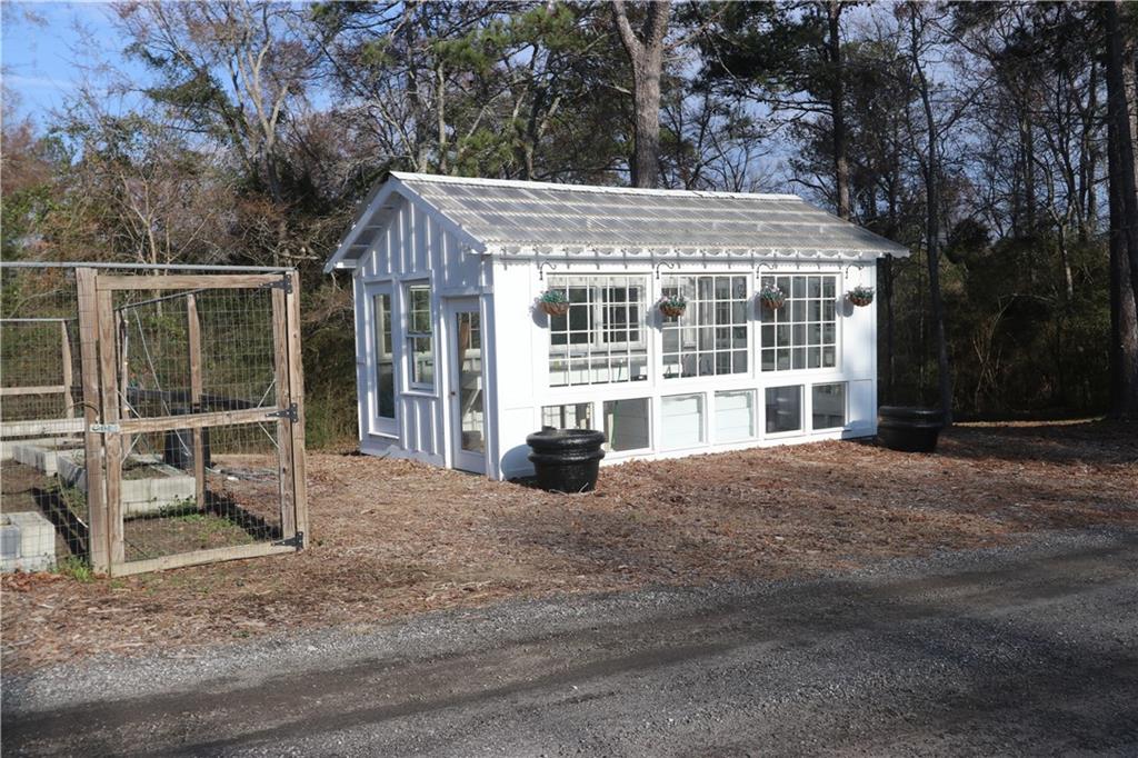 3251 Lenora Church Road Snellville, GA 30039 - Photo 43 of 48 a view of a house with backyard and garden