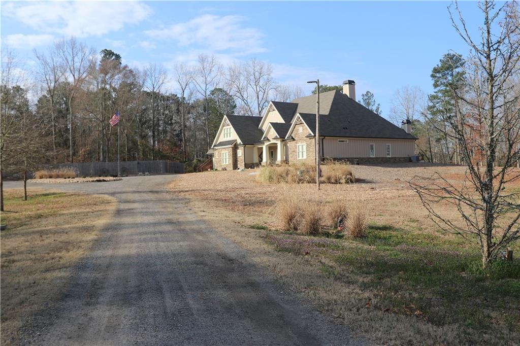 3251 Lenora Church Road Snellville, GA 30039 - Photo 44 of 48 a front view of a house with a yard covered with snow in front of house
