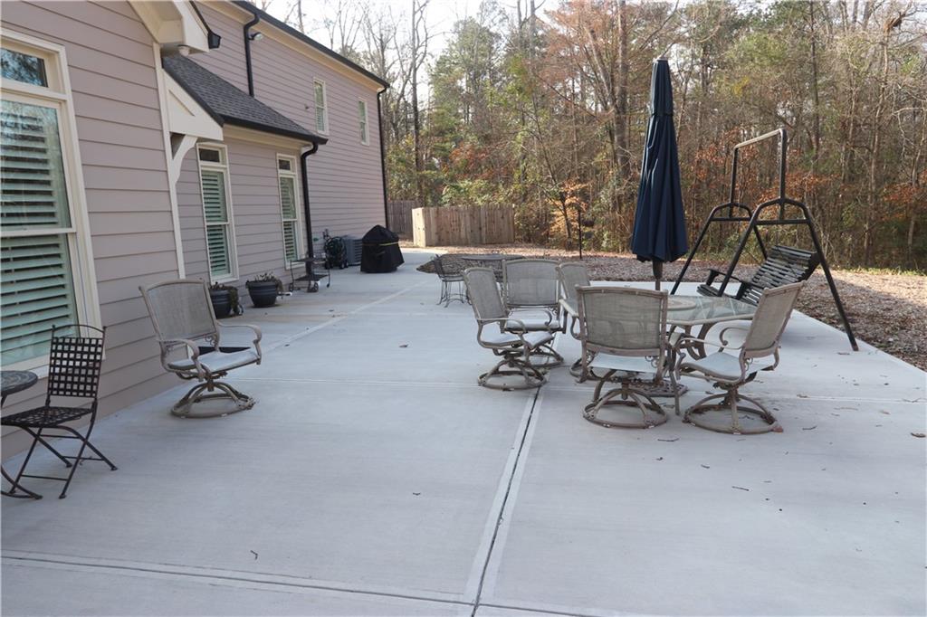 3251 Lenora Church Road Snellville, GA 30039 - Photo 46 of 48 a view of a patio with a table and chairs