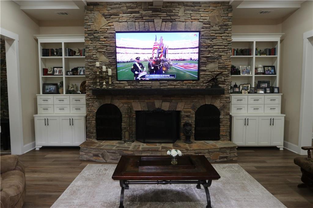 3251 Lenora Church Road Snellville, GA 30039 - Photo 5 of 48 a living room with a fireplace and a floor to ceiling window