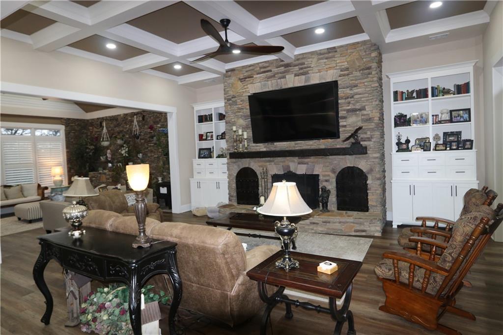 3251 Lenora Church Road Snellville, GA 30039 - Photo 6 of 48 a living room with furniture a flat screen tv and a fireplace