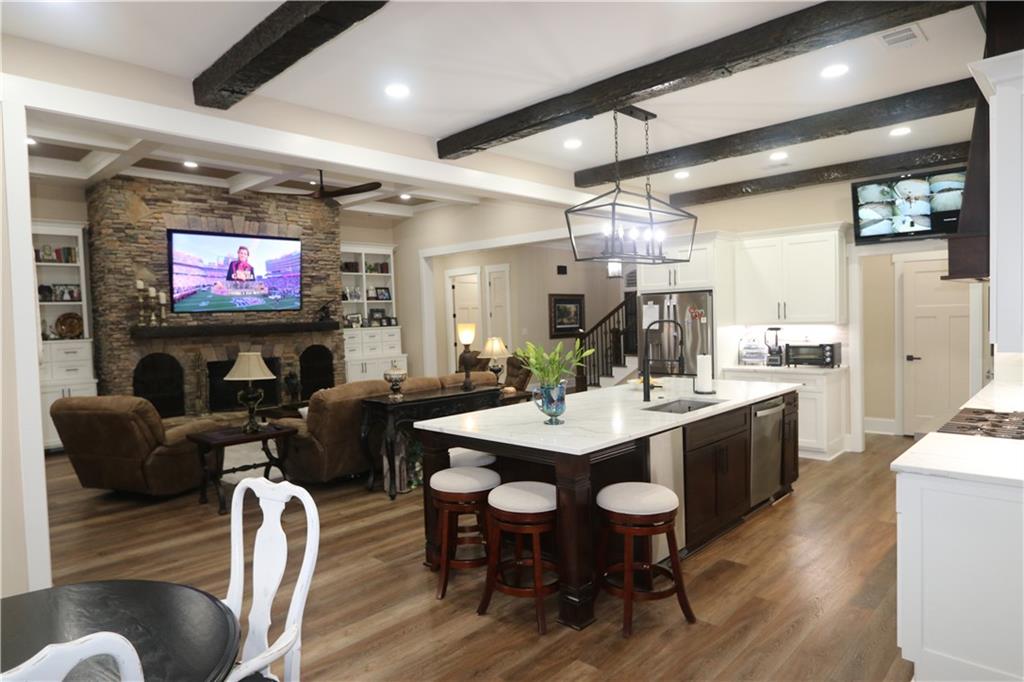3251 Lenora Church Road Snellville, GA 30039 - Photo 8 of 48 a view of a dining room with furniture and wooden floor