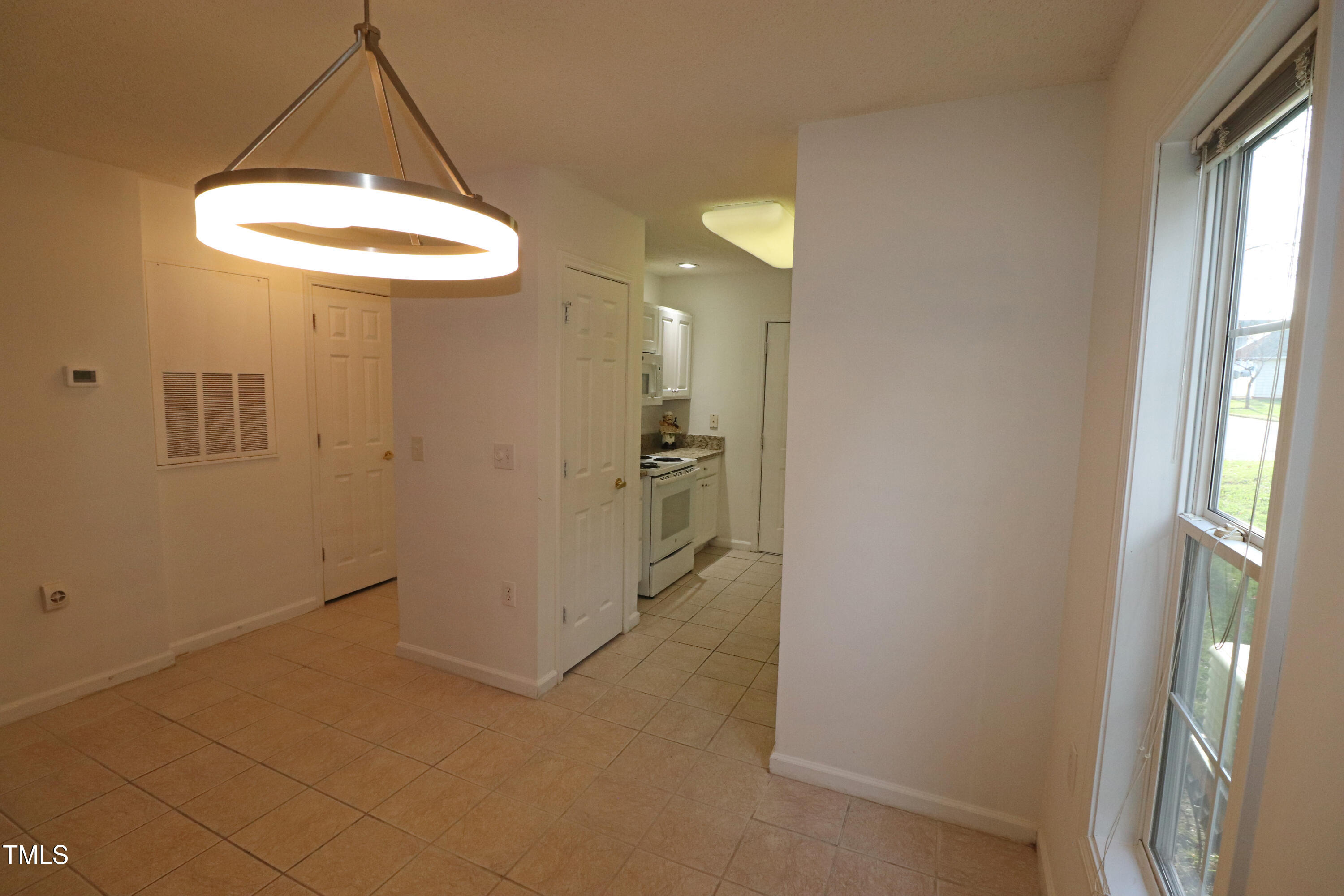 11331 Involute Place, Unit 100 Raleigh, NC 27617 - Photo 14 of 30 Dining Room Open to L. Room