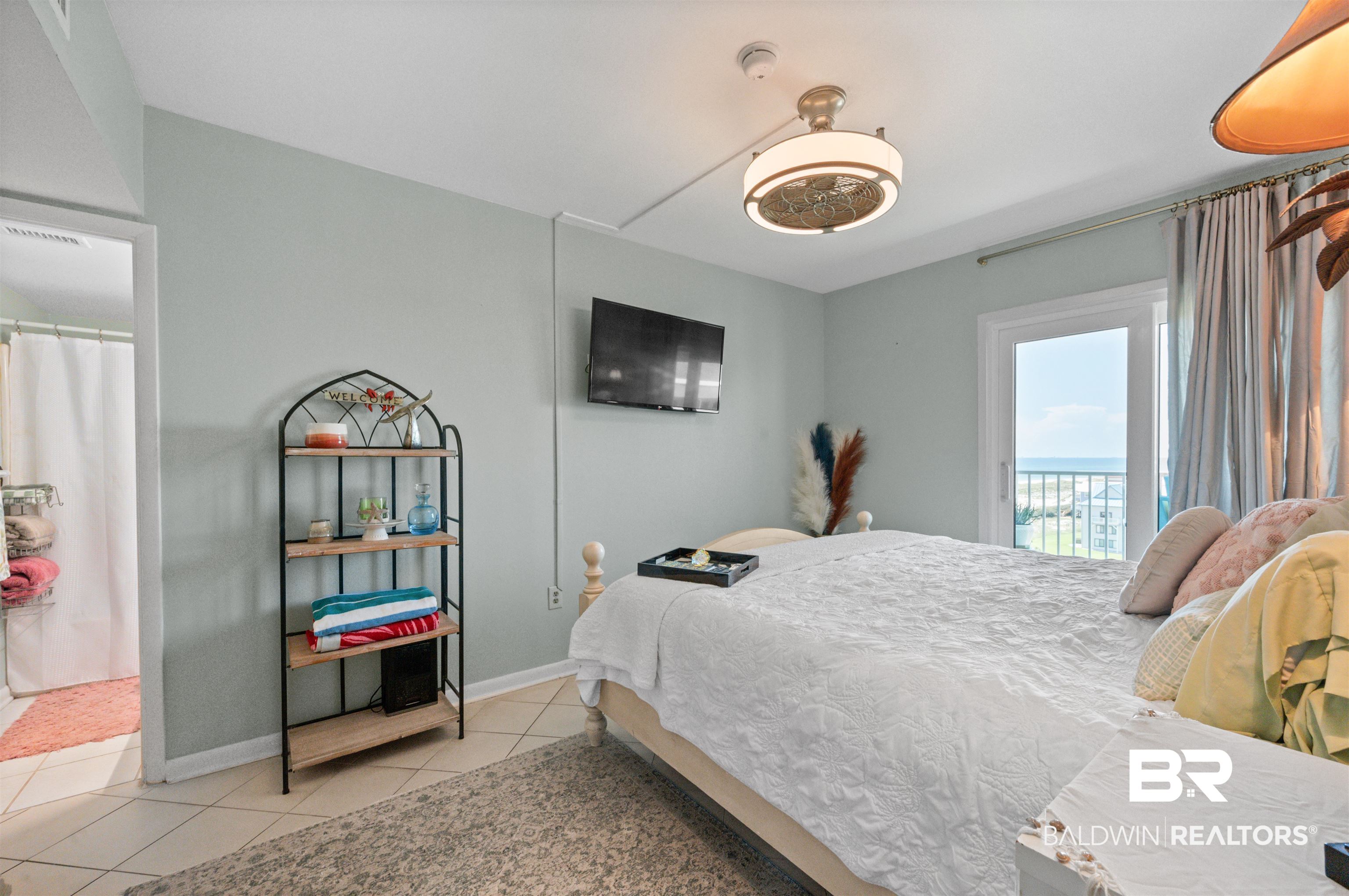 375 Plantation Road, Unit 5610 Gulf Shores, AL 36542 - Photo 9 of 33 Bedroom featuring light tile patterned flooring and access to outside