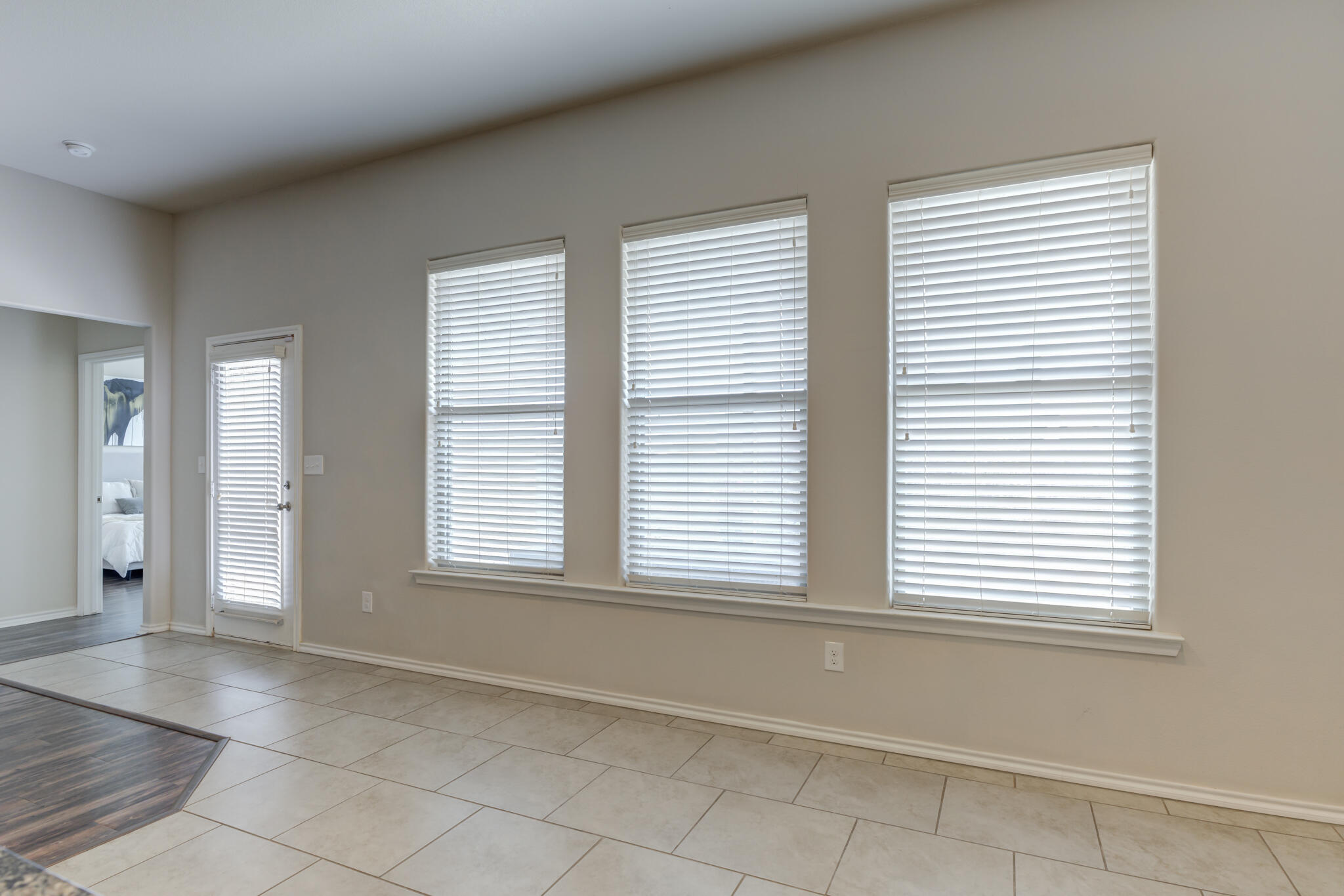 7201 94th Street Lubbock, TX 79424 - Photo 14 of 34 an empty room with windows