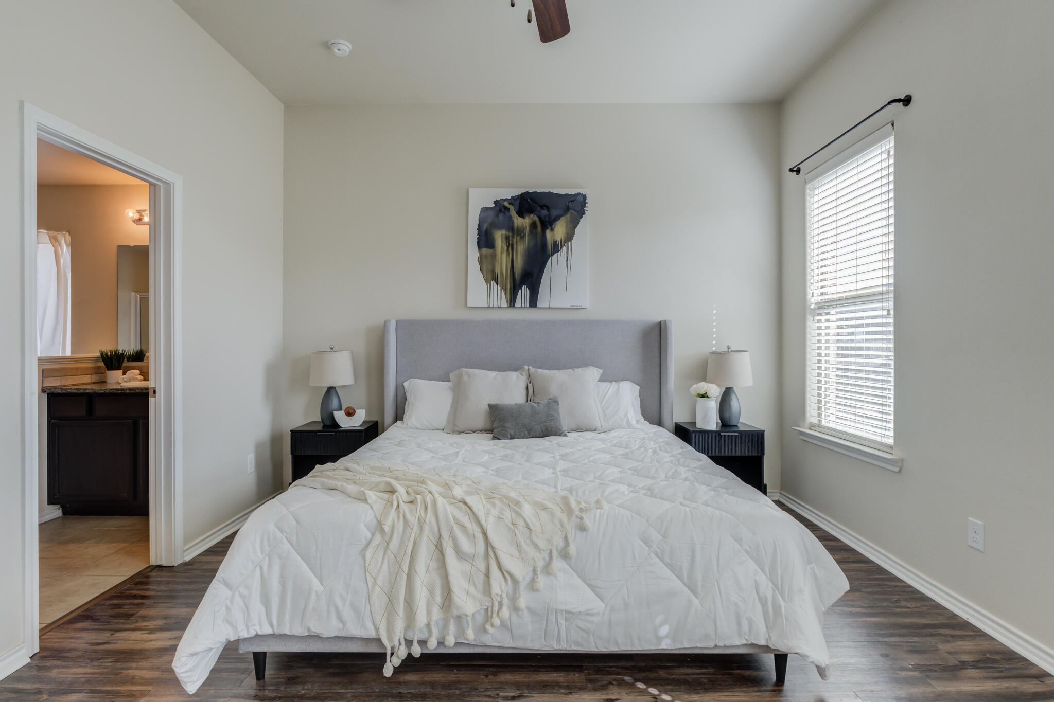 7201 94th Street Lubbock, TX 79424 - Photo 19 of 34 a bedroom with a bed and a window