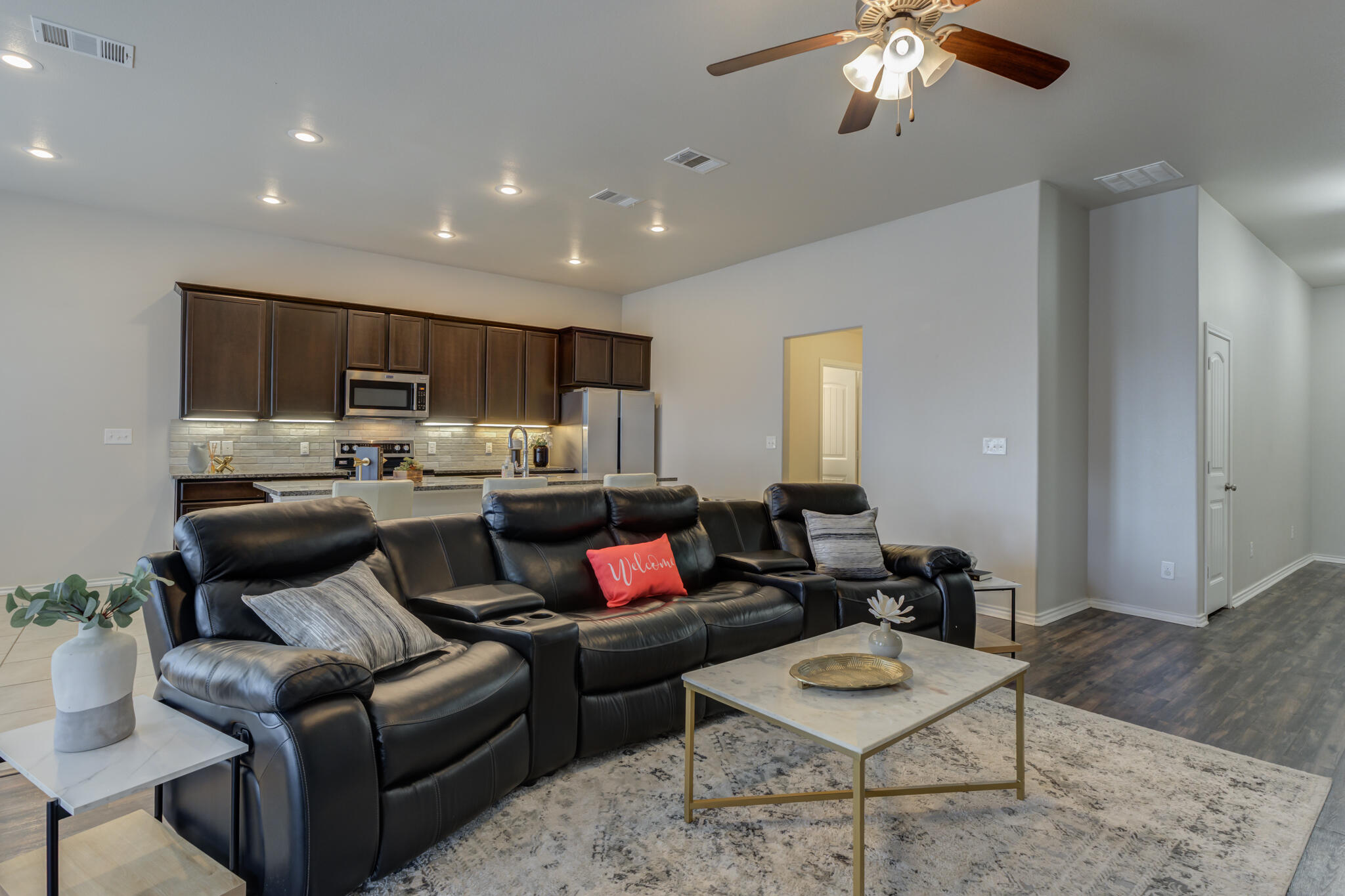7201 94th Street Lubbock, TX 79424 - Photo 7 of 34 a living room with furniture and a dining room
