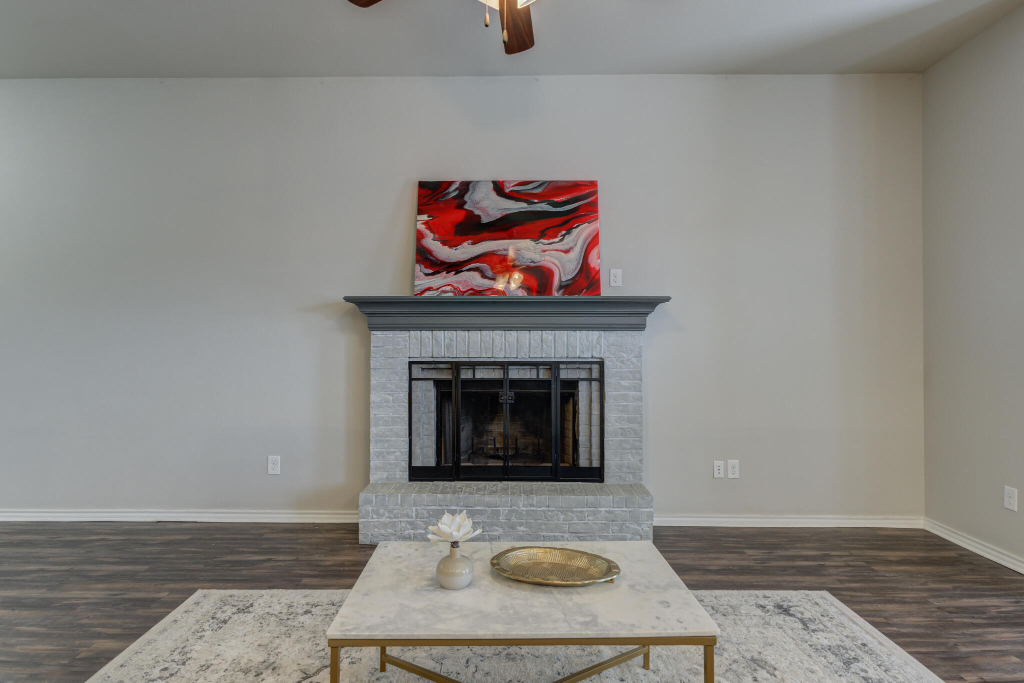 7201 94th Street Lubbock, TX 79424 - Photo 10 of 34 a living room with furniture and a fireplace