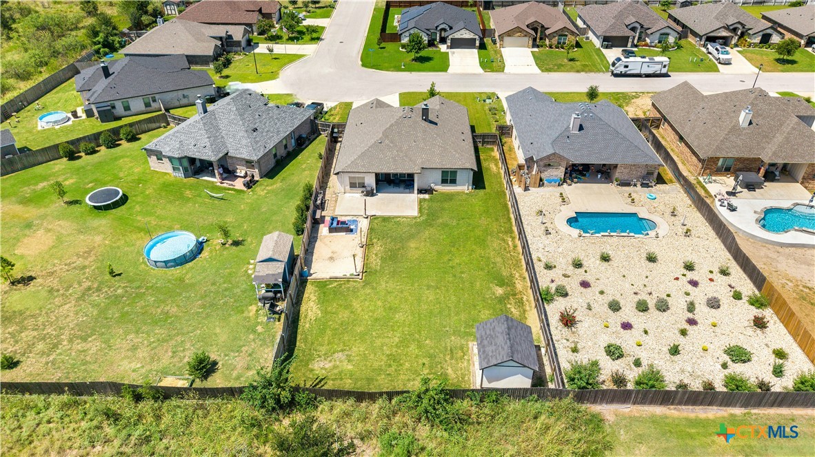 2021 Rustic Manor Drive Temple, TX 76502 - Photo 28 of 30 an aerial view of residential houses with outdoor space and swimming pool