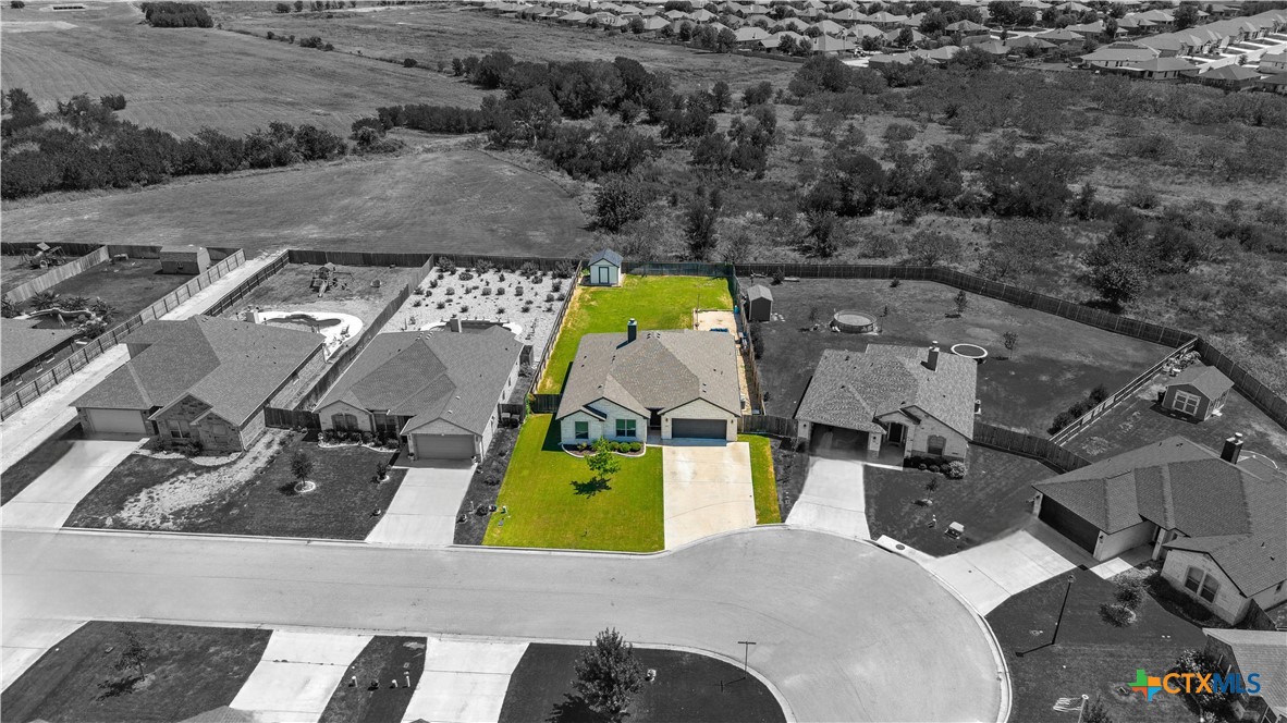 2021 Rustic Manor Drive Temple, TX 76502 - Photo 3 of 30 an aerial view of a house with a swimming pool