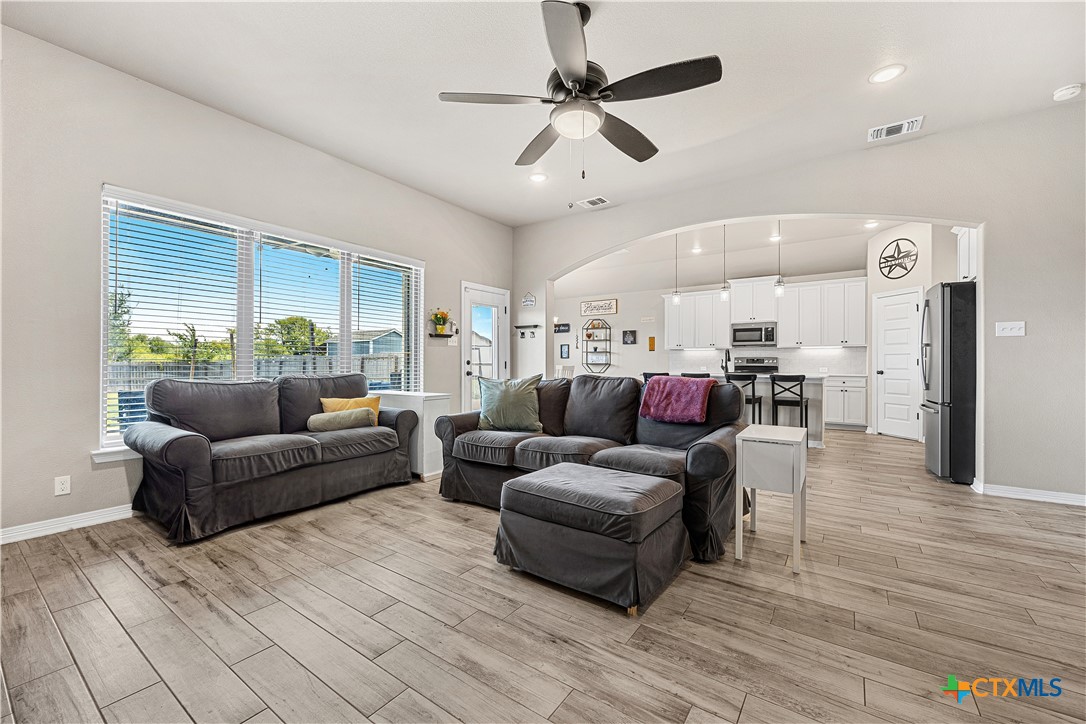 2021 Rustic Manor Drive Temple, TX 76502 - Photo 7 of 30 a living room with furniture and a wooden floor