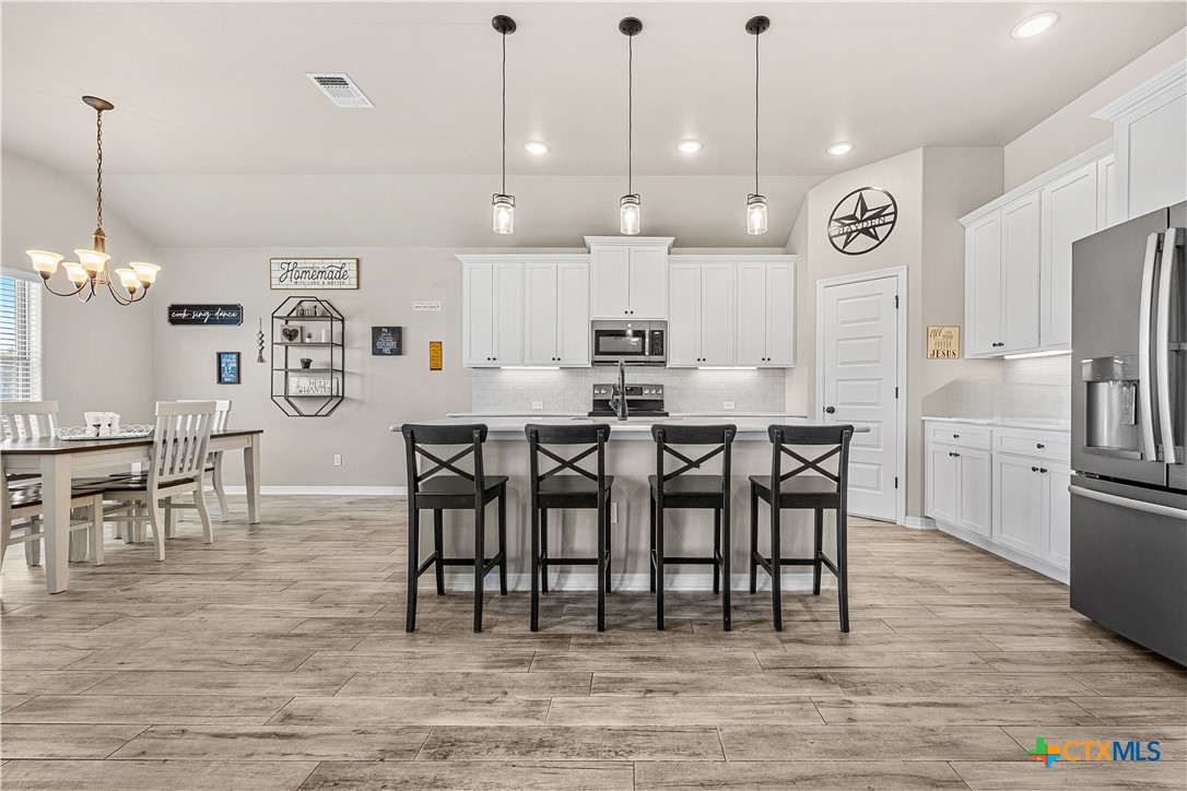 2021 Rustic Manor Drive Temple, TX 76502 - Photo 9 of 30 a large kitchen with a table and chairs