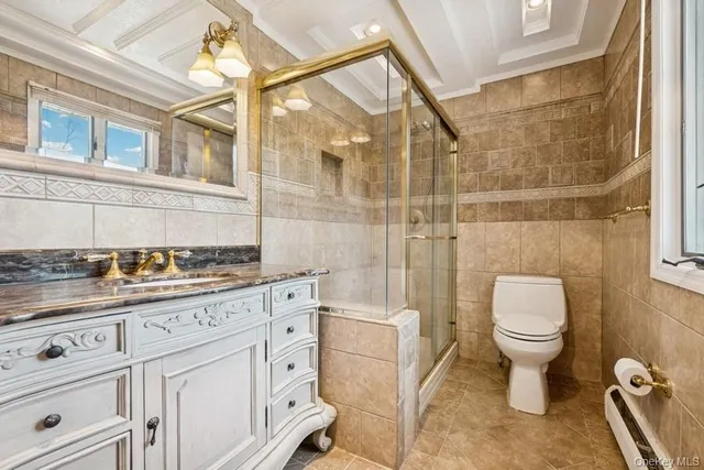 a bathroom with a toilet sink and a shower