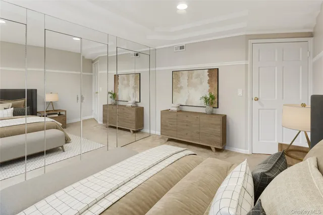 a bedroom with a bed and a couch