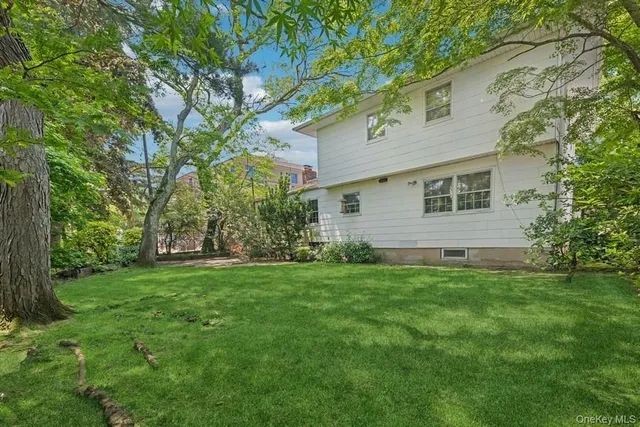 a backyard of a house with lots of green space