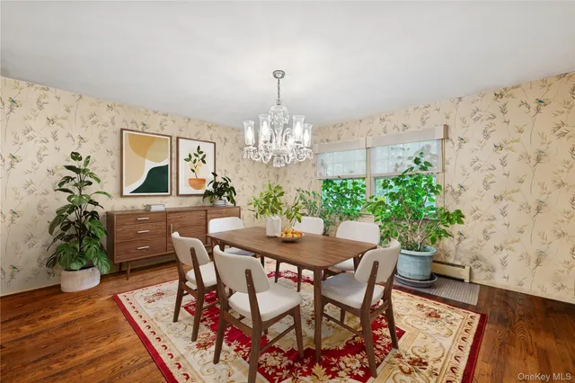 a dining room with furniture and wooden floor