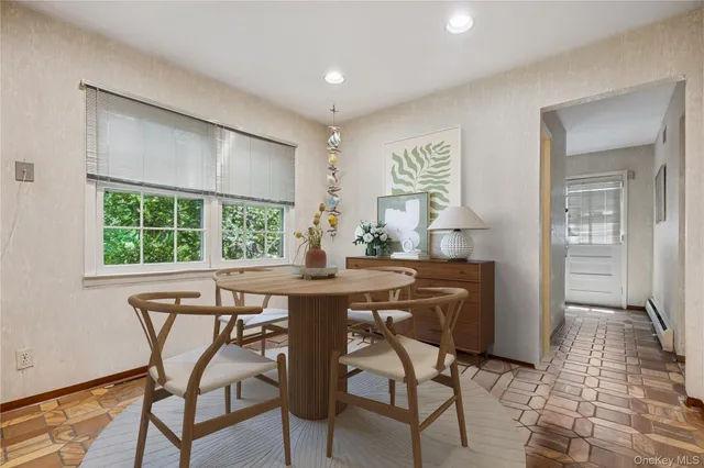 a view of a dining room with furniture window and outside view
