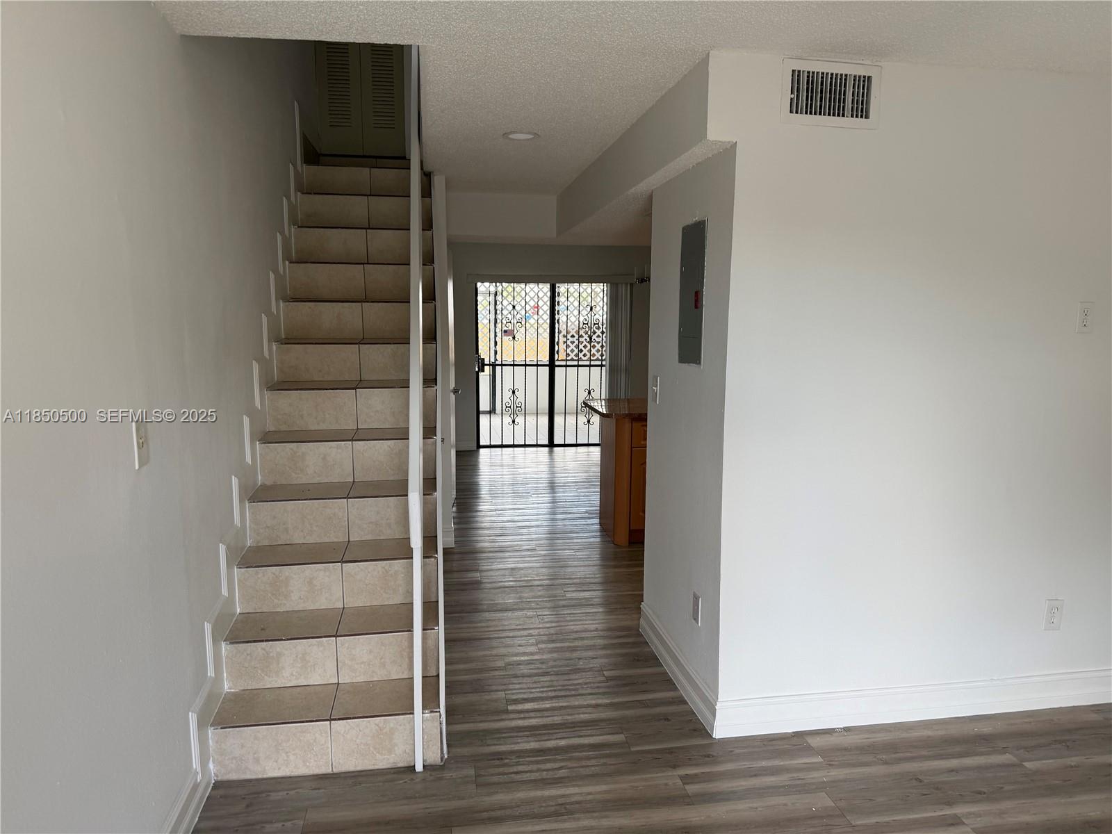 2289 West 52nd Street, Unit 23 Hialeah, FL 33016 - Photo 10 of 23 a view of entryway with wooden floor