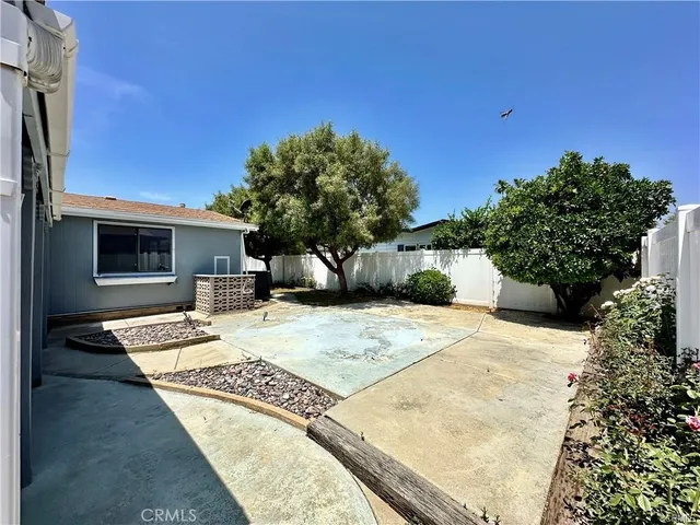 a view of a backyard of the house