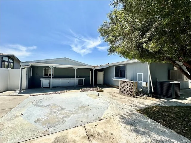 a house with trees in the background