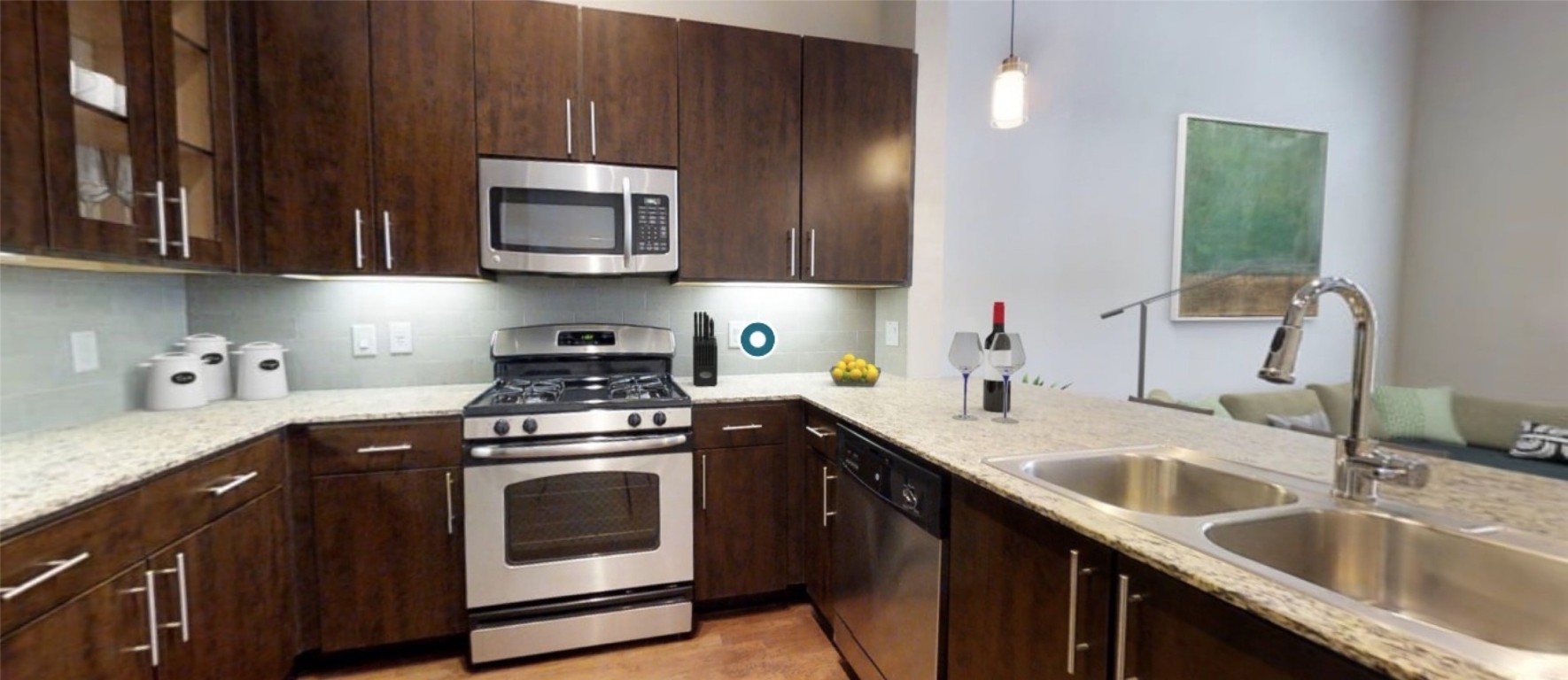 2525 McCue Road, Unit 112 Houston, TX 77056 - Photo 17 of 32 a kitchen with stainless steel appliances granite countertop a sink stove and microwave