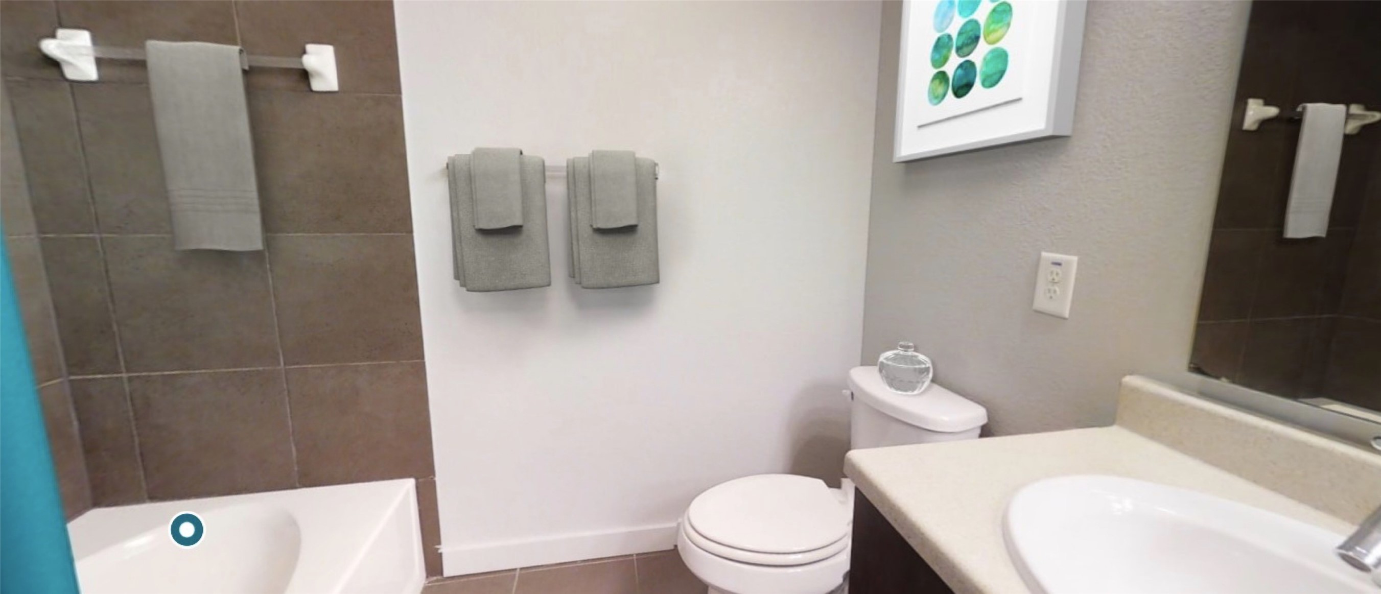 2525 McCue Road, Unit 153 Houston, TX 77056 - Photo 21 of 32 a white toilet sitting next to a bathroom sink and tub