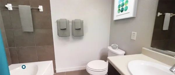 a view of kitchen and hallway with wooden floor