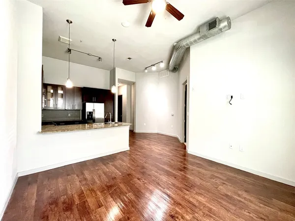 a view of a living room with a ceiling fan