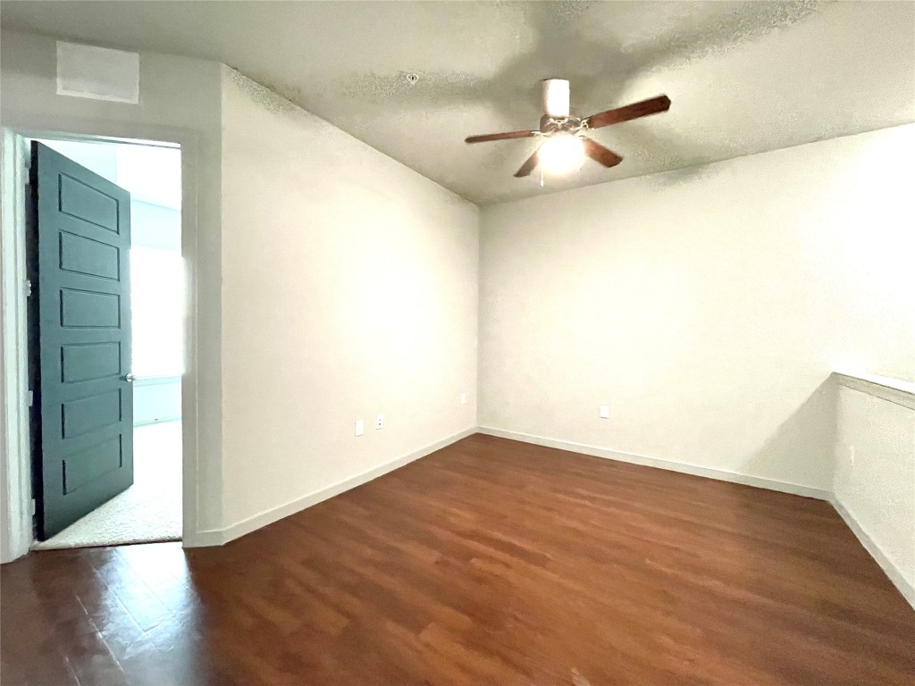 2525 McCue Road, Unit 112 Houston, TX 77056 - Photo 9 of 32 a view of an empty room with wooden floor