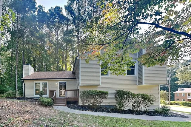 front view of a house with a garden