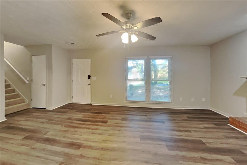 3117 Calumet Circle Northwest Kennesaw, GA 30152 - Photo 3 of 21 a view of an empty room with wooden floor and a window