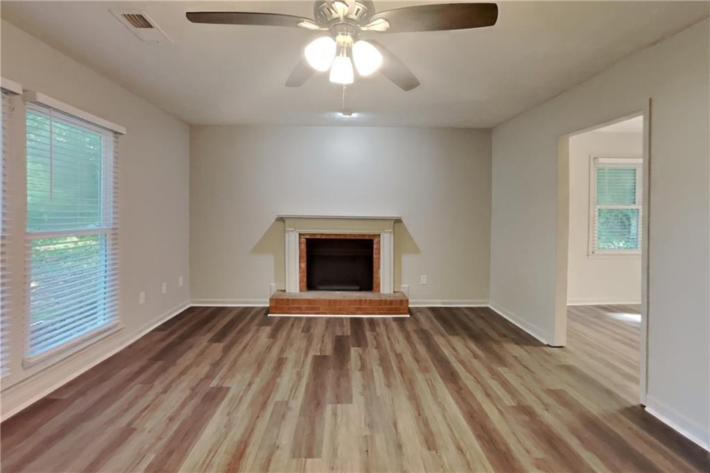 3117 Calumet Circle Northwest Kennesaw, GA 30152 - Photo 4 of 21 wooden floor in an empty room with a window