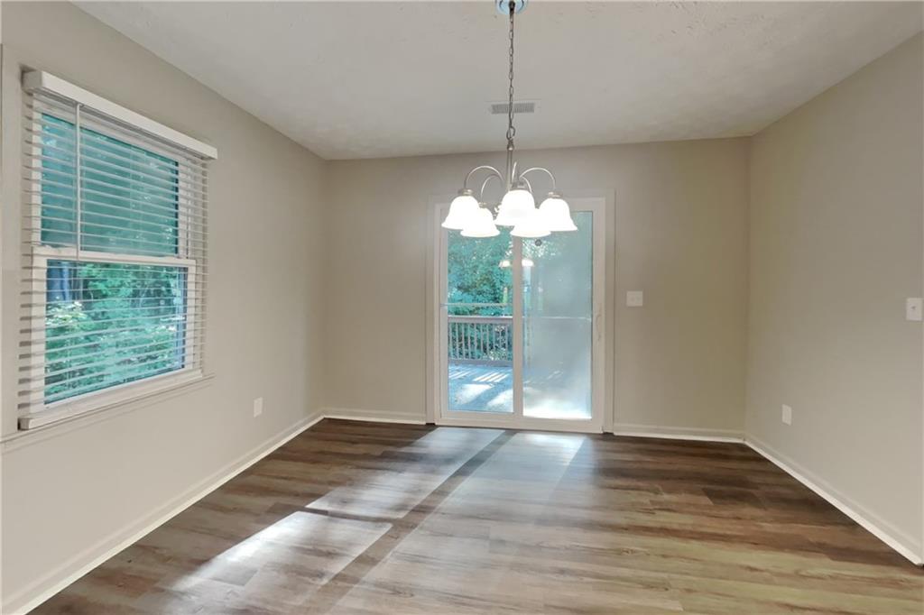 3117 Calumet Circle Northwest Kennesaw, GA 30152 - Photo 8 of 21 a view of an empty room with wooden floor and a window
