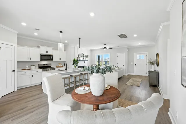 a kitchen with a dining table and chairs