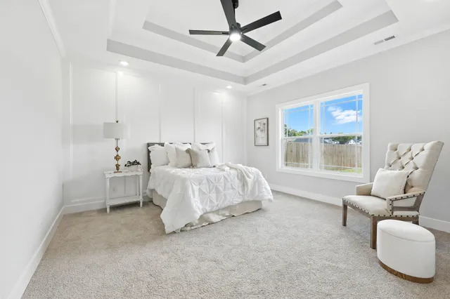 a spacious bedroom with a bed and furniture