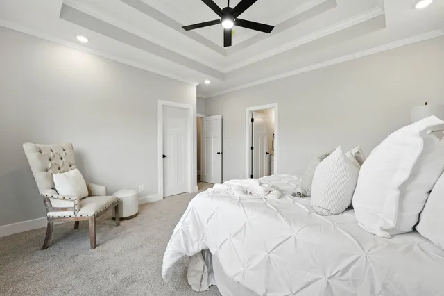 a bedroom with a bed and a chair