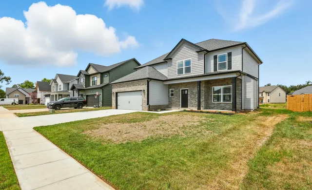 a view of a yard with cars