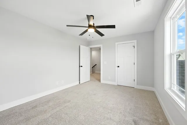 a bathroom with a double vanity sink mirror double and a bathtub